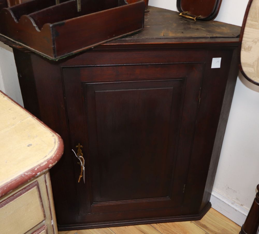 A George III oak hanging corner cabinet, W.94cm, D.55cm, H.97cm